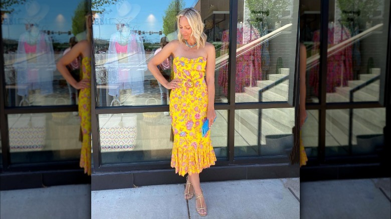 woman wearing yellow floral strapless dress