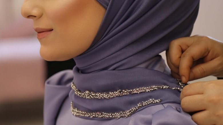 Jewels sewn into woman's hijab