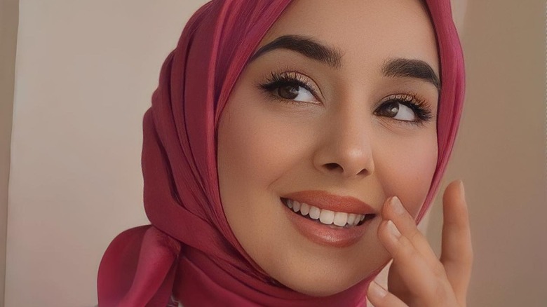 Smiling woman in soft pink hijab