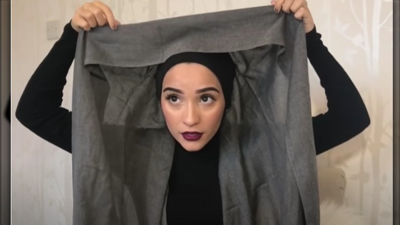 Woman wrapping hijab