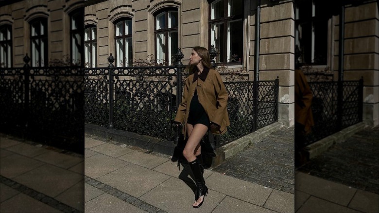 Woman in brown jacket