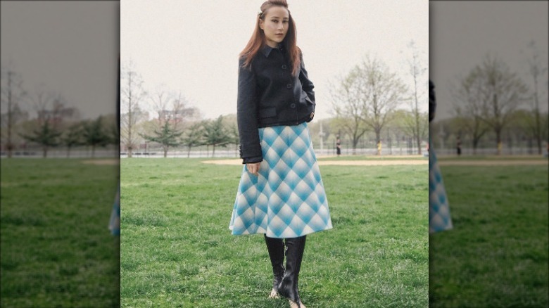 Woman in blue and white skirt