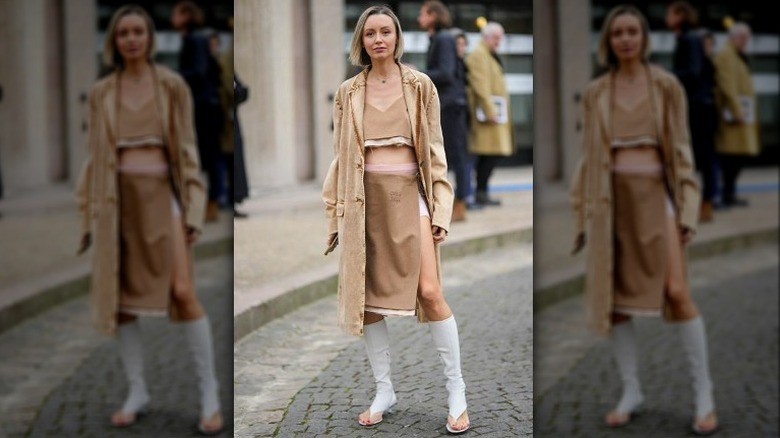 Woman in tan outfit