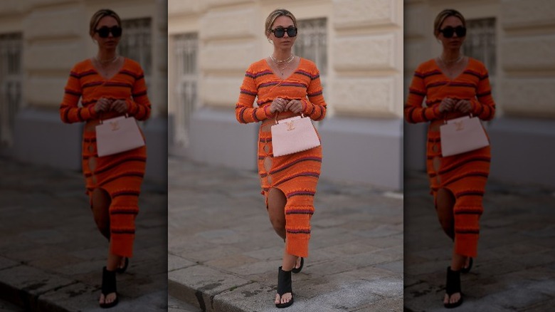 Woman in pink striped outfit