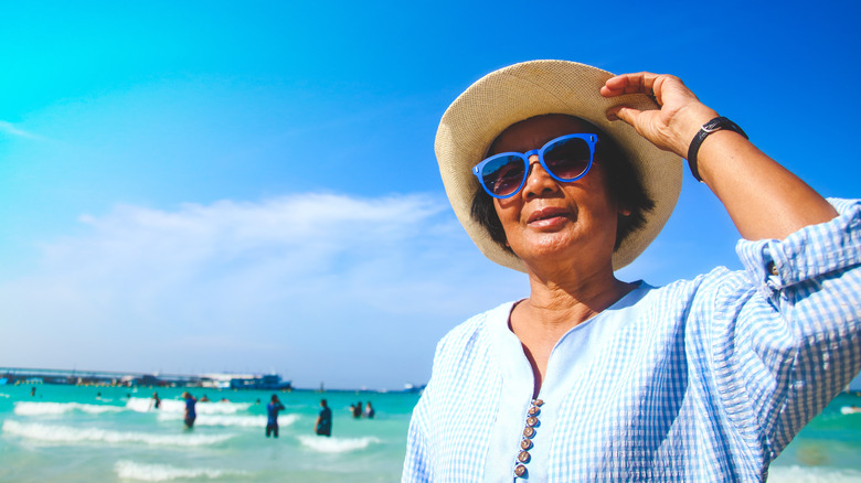 Woman wearing sun protection at beach