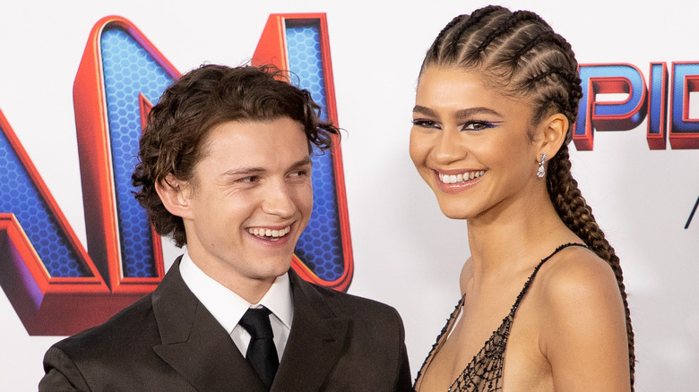 Tom Holland and Zendaya posing for a photo together