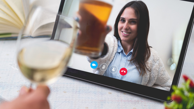 Two people cheers via a web call