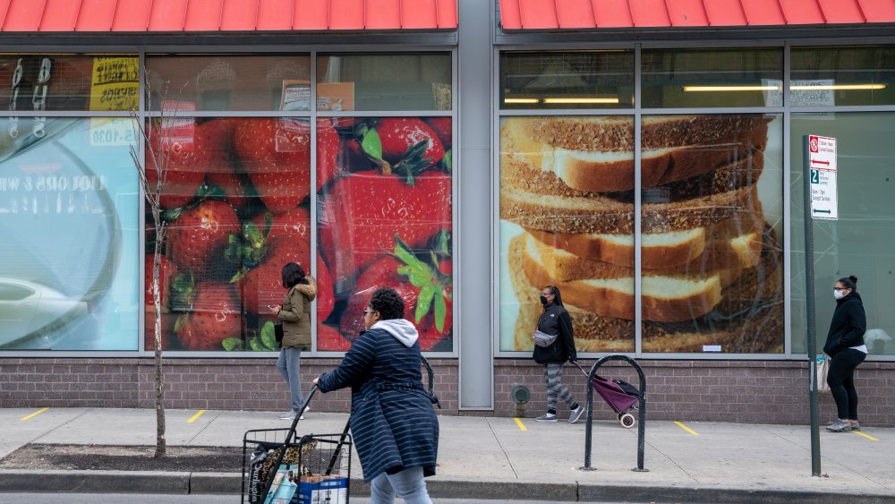 Customers outside of an Aldi store