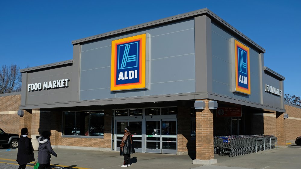 The exterior of an Aldi store, with shoppers