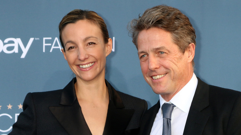 Hugh Grant and Anna Eberstein at event