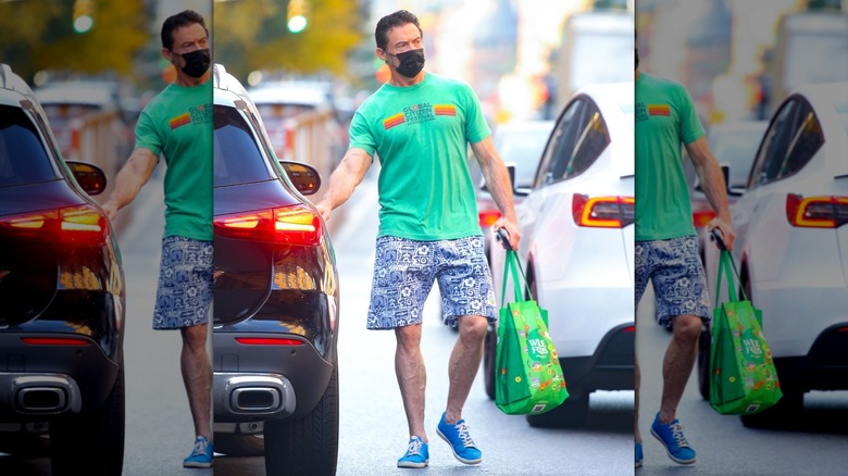 Hugh Jackman carrying a grocery bag