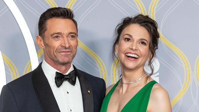 Hugh Jackman smiling with Sutton Foster