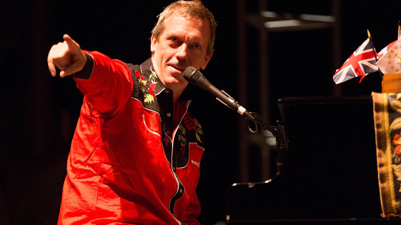 Hugh Laurie playing piano on stage 