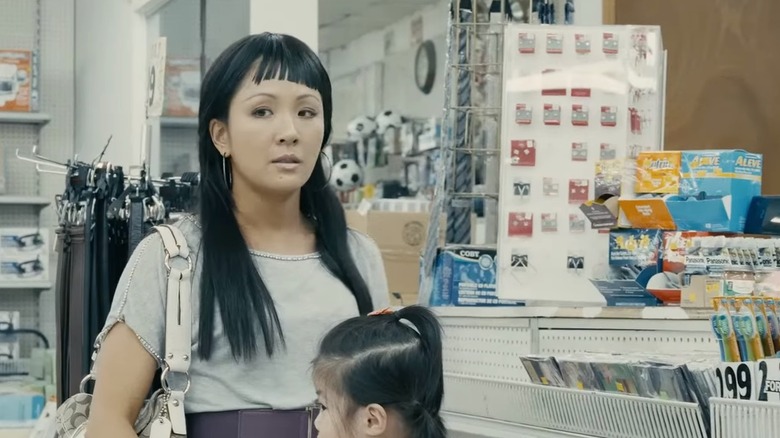 Constance Wu and a child in Hustlers