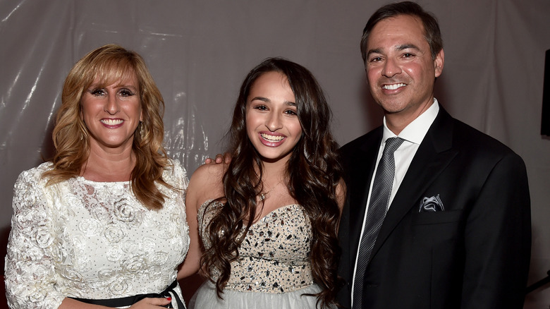 Jazz Jennings posing with her mom and dad