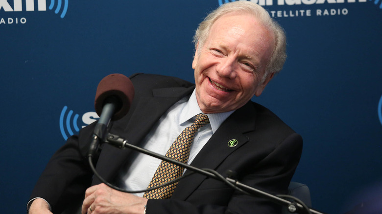 Joe Lieberman laughing at microphone