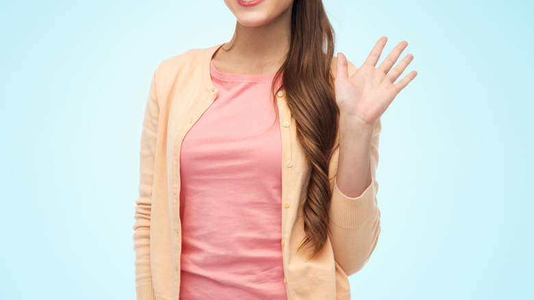 woman arms folded thinking