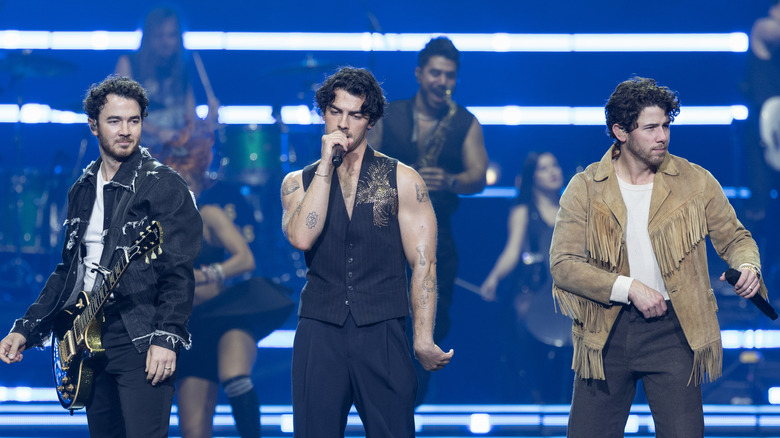 Nick, Kevin, and Joe Jonas performing