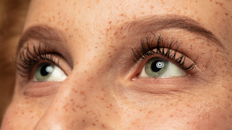 Green eyes, freckled face