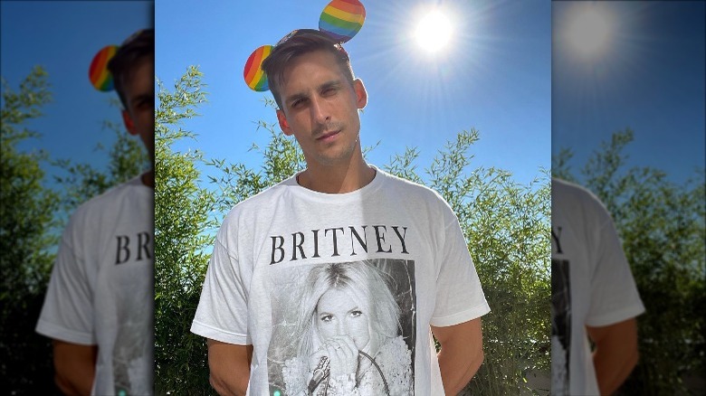 Cody Rigsby wearing Britney Spears shirt and pride Mickey ears