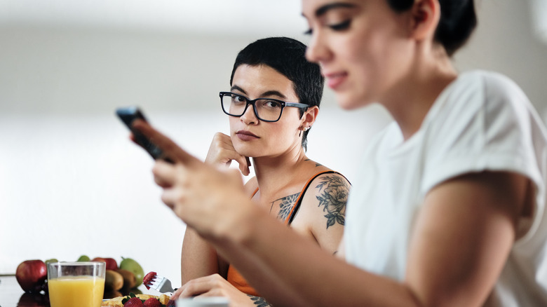 woman glaring at girlfriend