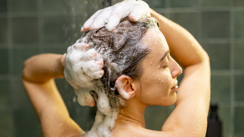 Woman shampooing her hair