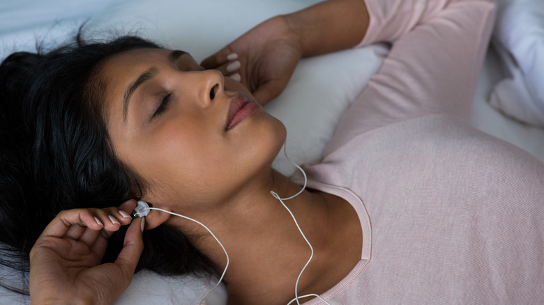 woman peacefully listening to music