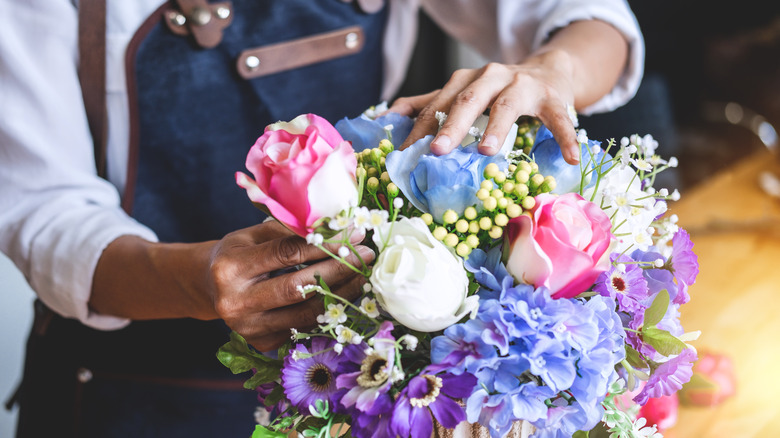 Arranging colorful flowers