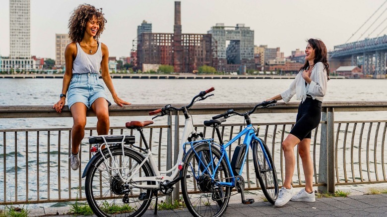 women biking and laughing