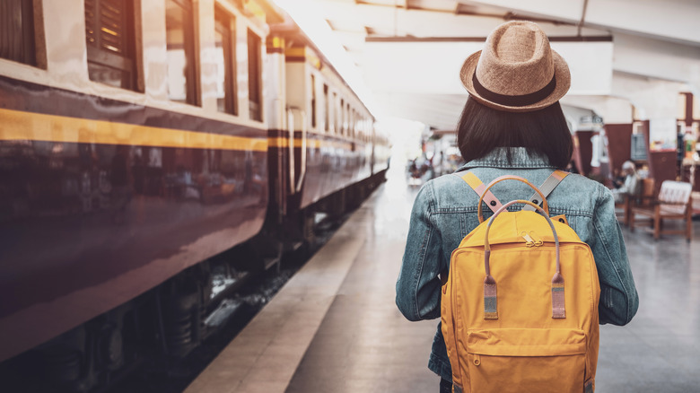 Female traveler in a train station