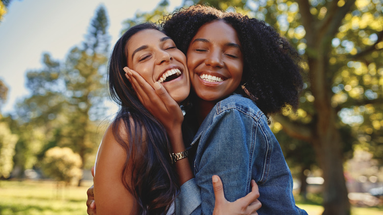 Two women hugging outdoors