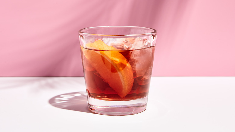 Negroni cocktail on a pink background