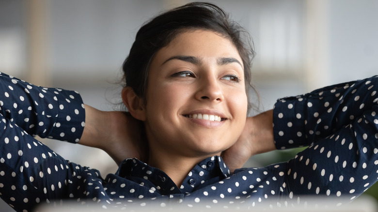 Woman happy in her own thoughts