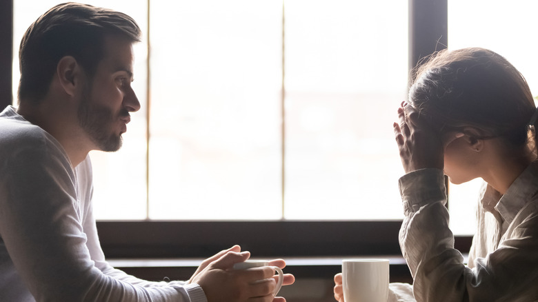 Couple having a serious conversation over coffee