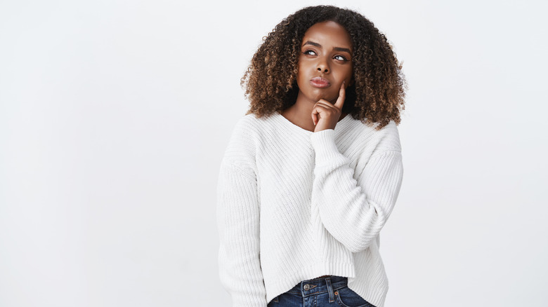 Woman in white sweater 