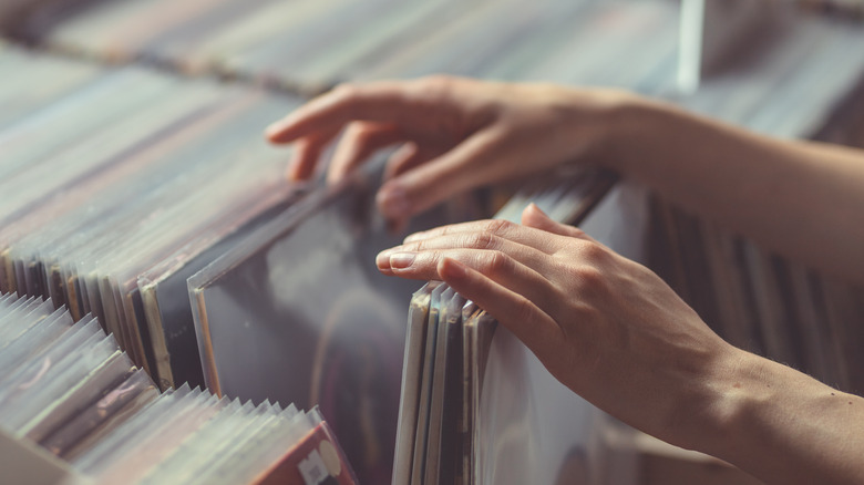 hand searching through vinyls 