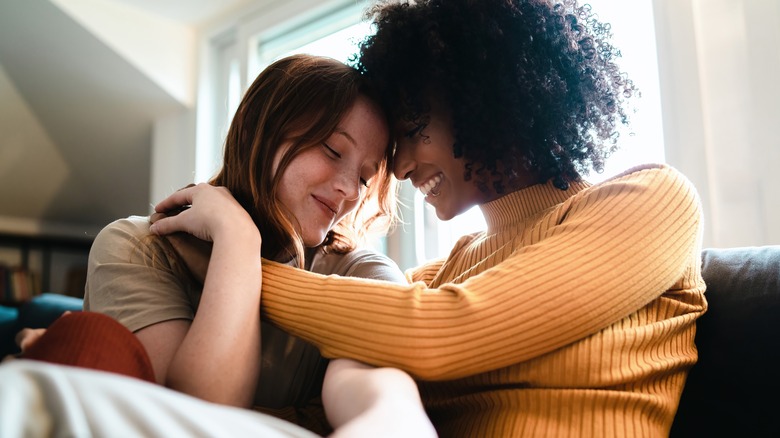 A queer couple sitting on a couch