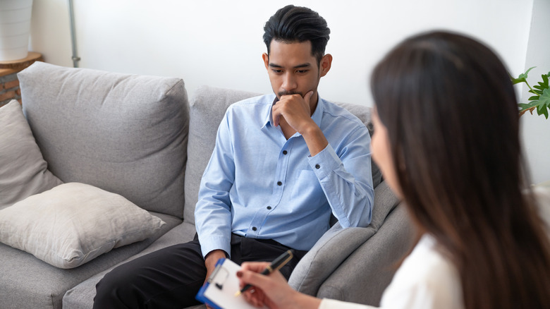 Psychologist sitting down with her patient