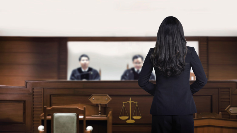 Lawyer standing in front of judge