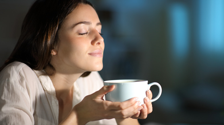 Woman enjoying a cup of espresso