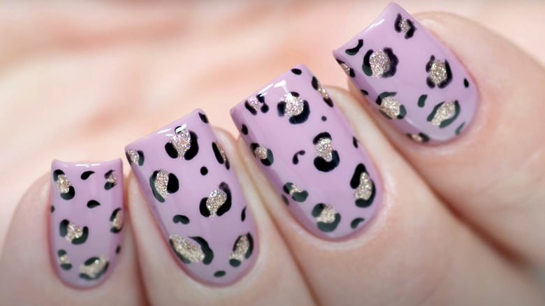 Purple glittery animal print manicure