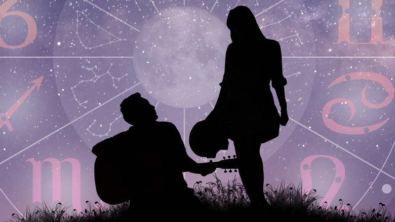 Couple silhouette with zodiac chart