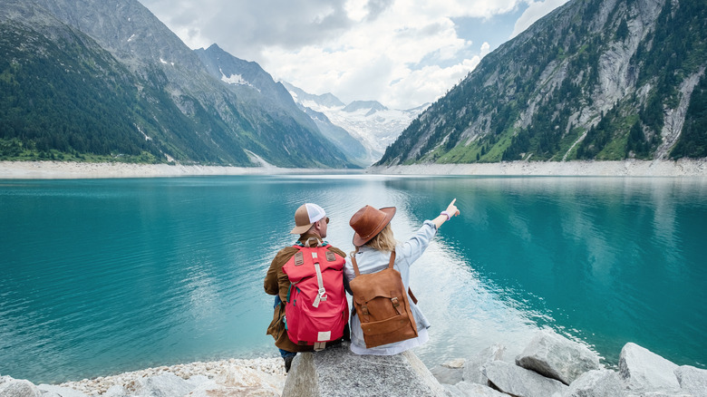 Couple admiring the mountains and sea