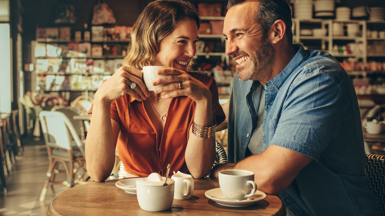 Couple drinking coffee at a cafe