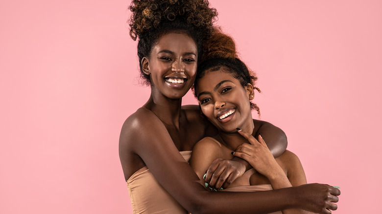 Two women embracing 