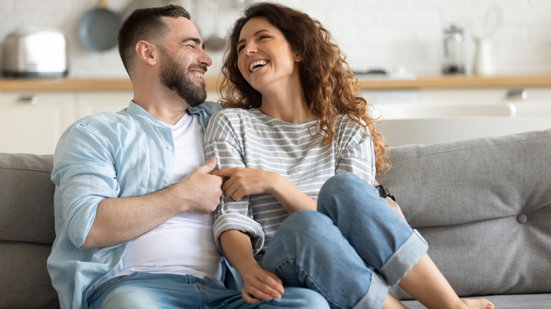 happy couple sitting together and smiling