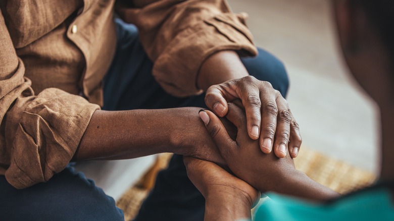 couple holding hands