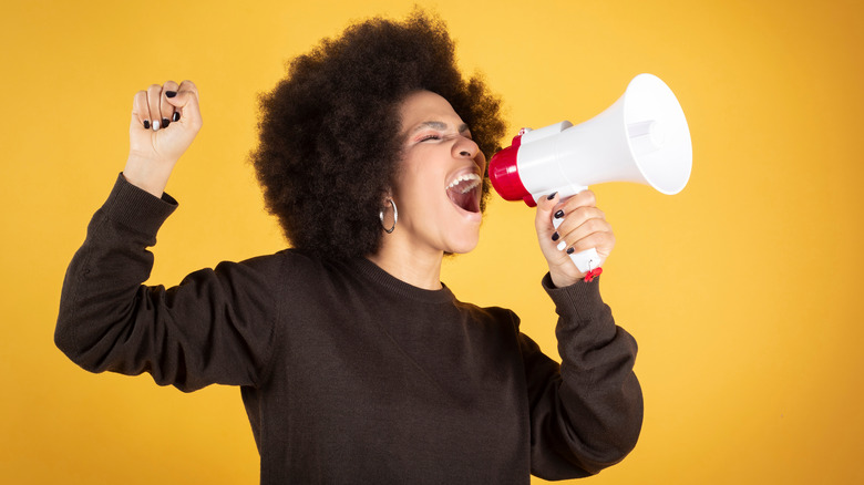 Young woman with megaphone