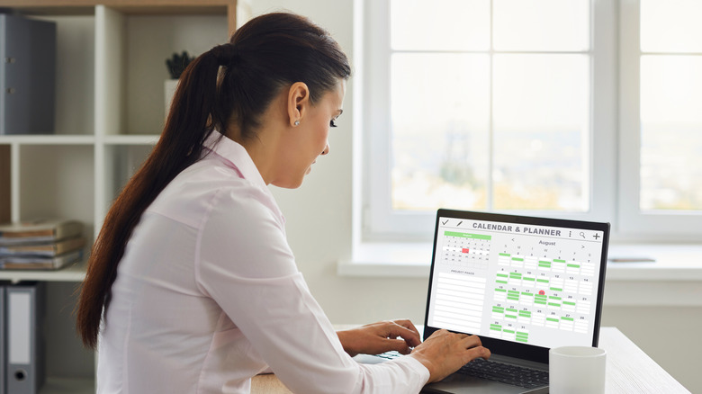 Woman typing on computer