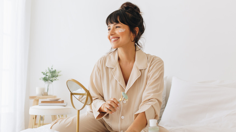 woman doing a facial massage 